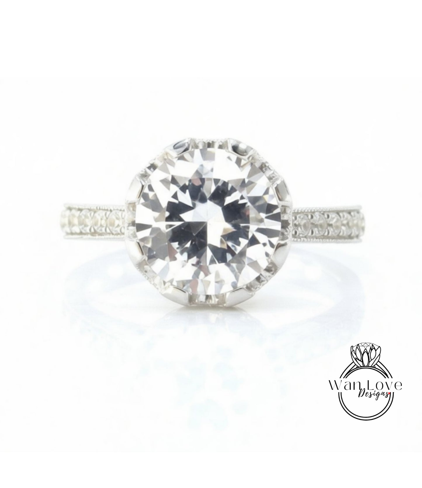 A large, clear diamond engagement ring with a halo of smaller diamonds around the center stone.
