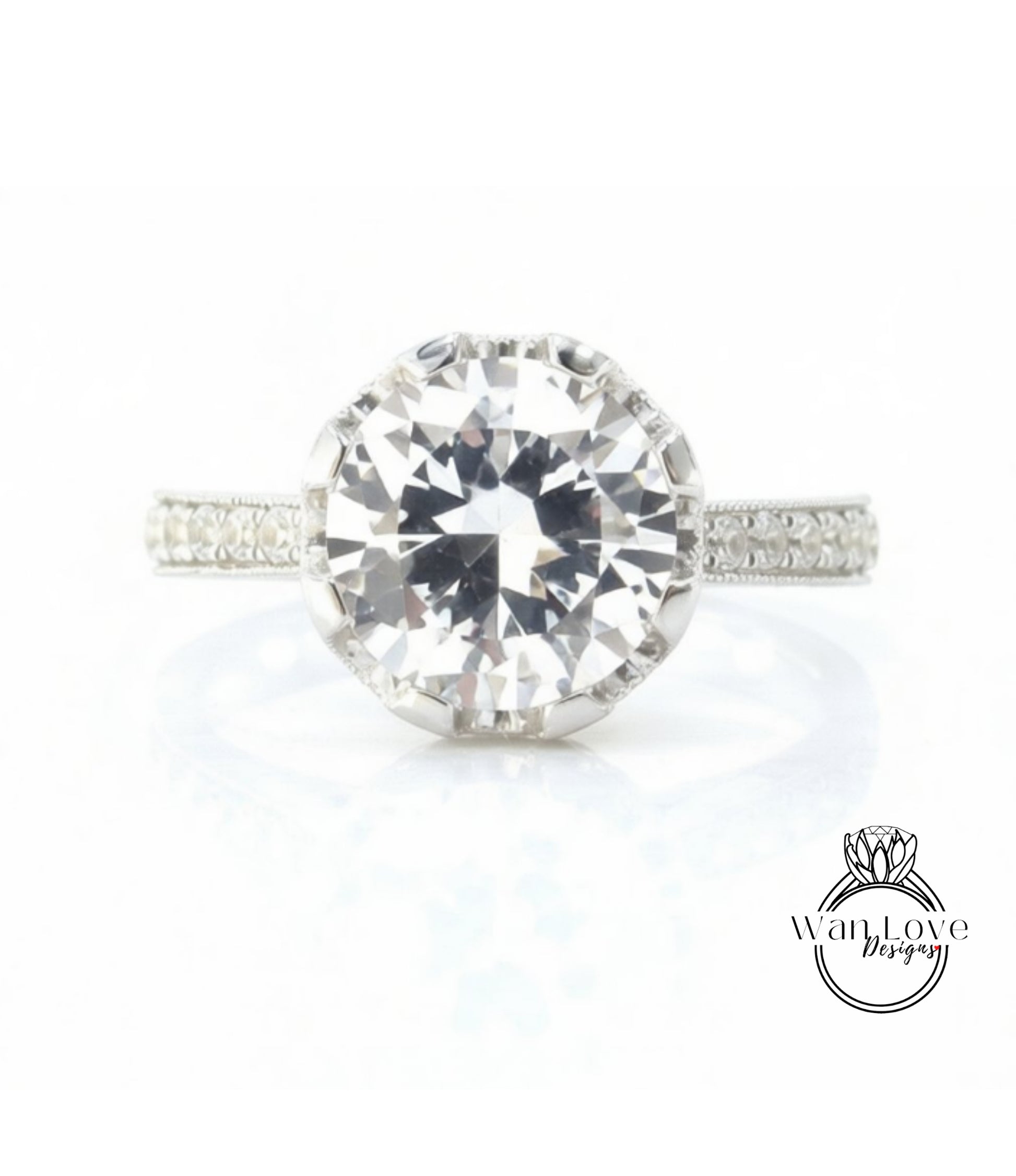 A large, clear diamond engagement ring with a halo of smaller diamonds around the center stone.
