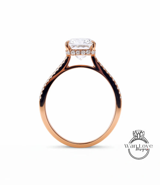A gold ring with a large diamond set in the center, showcasing the intricate design and craftsmanship of the piece.
