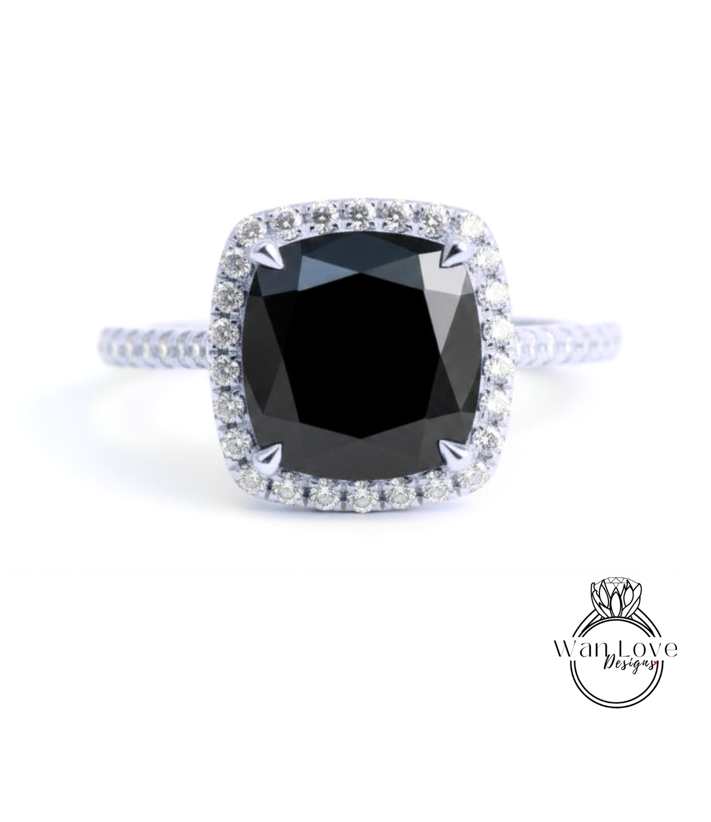 A diamond engagement ring with a large black gemstone set in a halo of smaller diamonds.