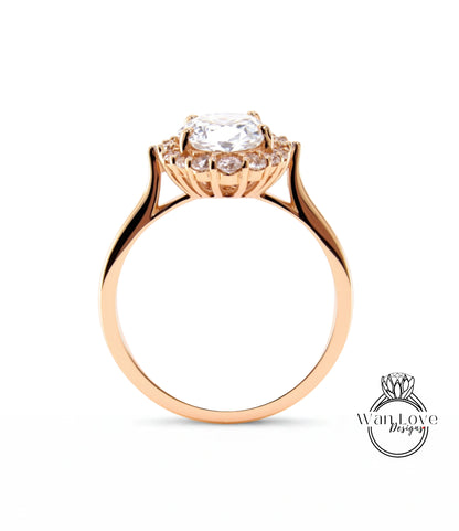 A gold ring with a large central diamond surrounded by smaller diamonds, set in a halo-like design.