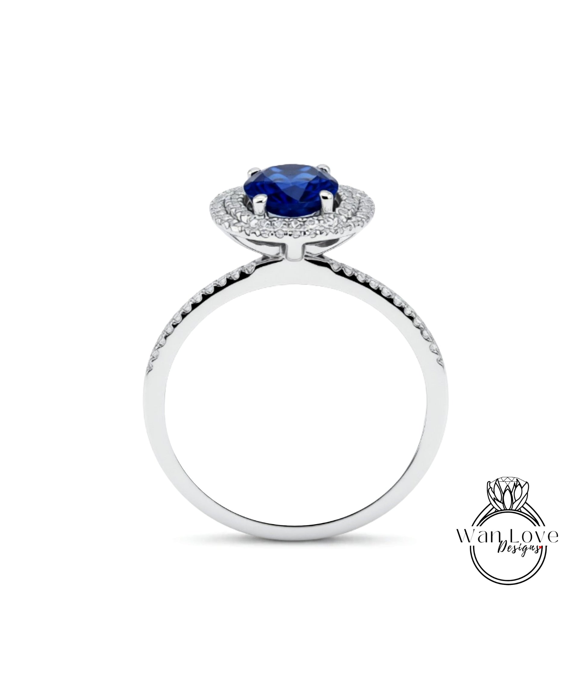A silver ring with a large blue gemstone at the center, surrounded by smaller diamonds.