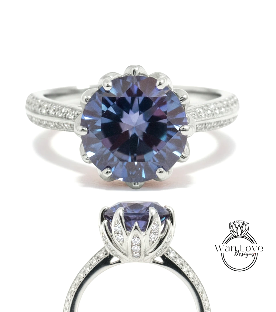 A stunning blue diamond engagement ring with a large central gemstone surrounded by smaller diamonds set in a silver band.
