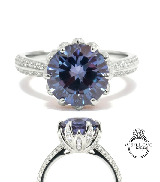 A stunning blue diamond engagement ring with a large central gemstone surrounded by smaller diamonds set in a silver band.