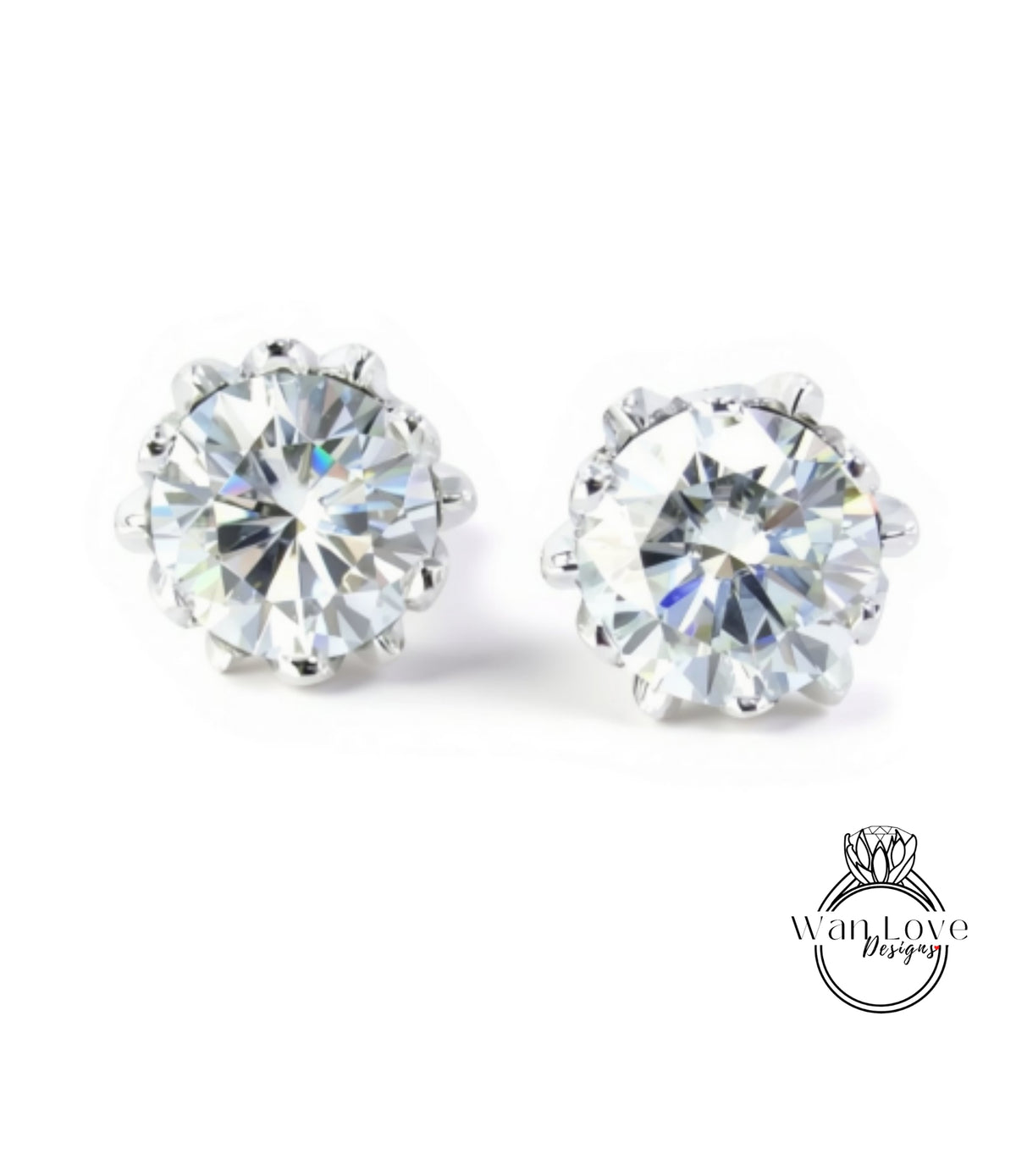 A pair of elegant diamond earrings with a large, brilliant-cut diamond set in a silver metal frame.