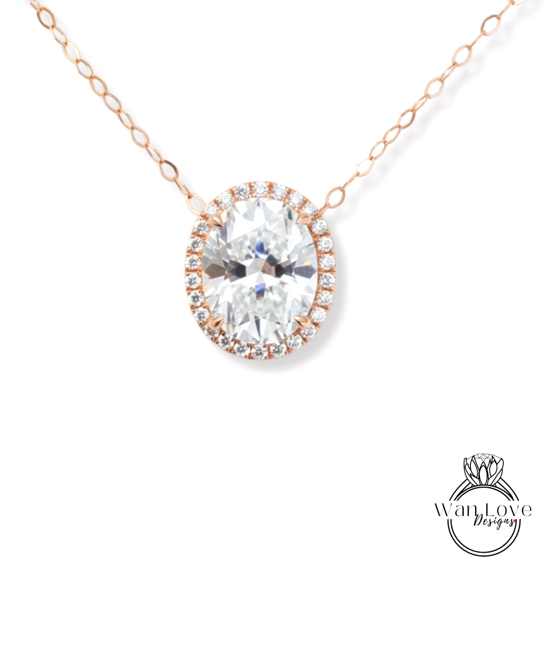 A necklace with a large oval-shaped diamond set in a halo of smaller diamonds, surrounded by a chain of smaller diamonds.