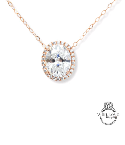 A necklace with a large oval-shaped diamond set in a halo of smaller diamonds, surrounded by a chain of smaller diamonds.