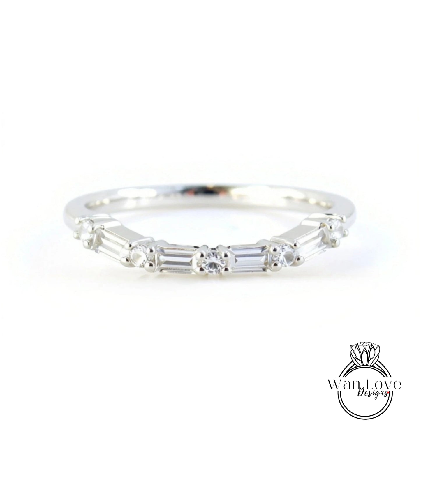 A silver ring with a row of small diamonds set in the band.