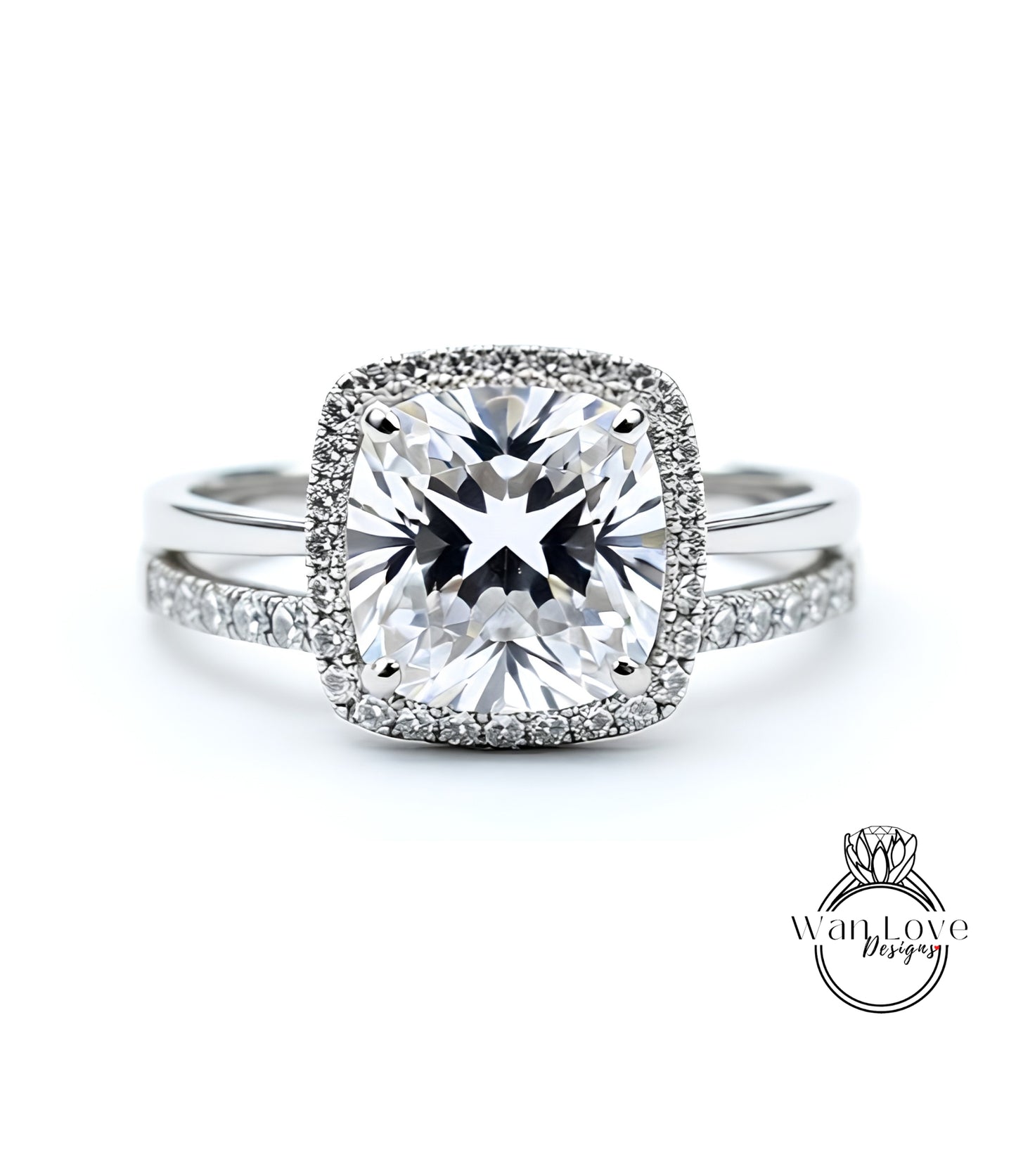 A stunning diamond engagement ring with a large, brilliant-cut diamond set in a halo of smaller diamonds, surrounded by a halo of smaller diamonds.