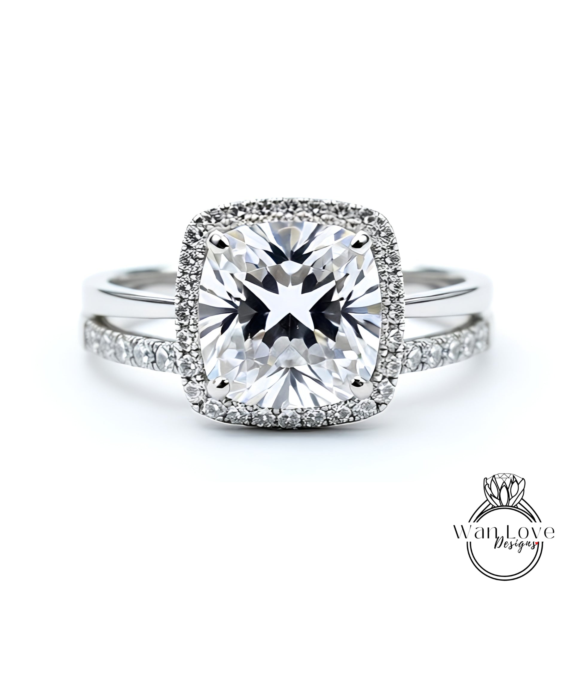 A stunning diamond engagement ring with a large, brilliant-cut diamond set in a halo of smaller diamonds, surrounded by a halo of smaller diamonds.