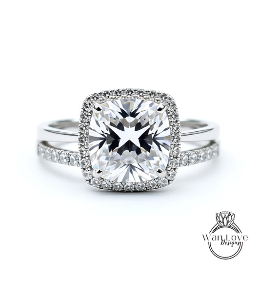 A stunning diamond engagement ring with a large, brilliant-cut diamond set in a halo of smaller diamonds, surrounded by a halo of smaller diamonds.
