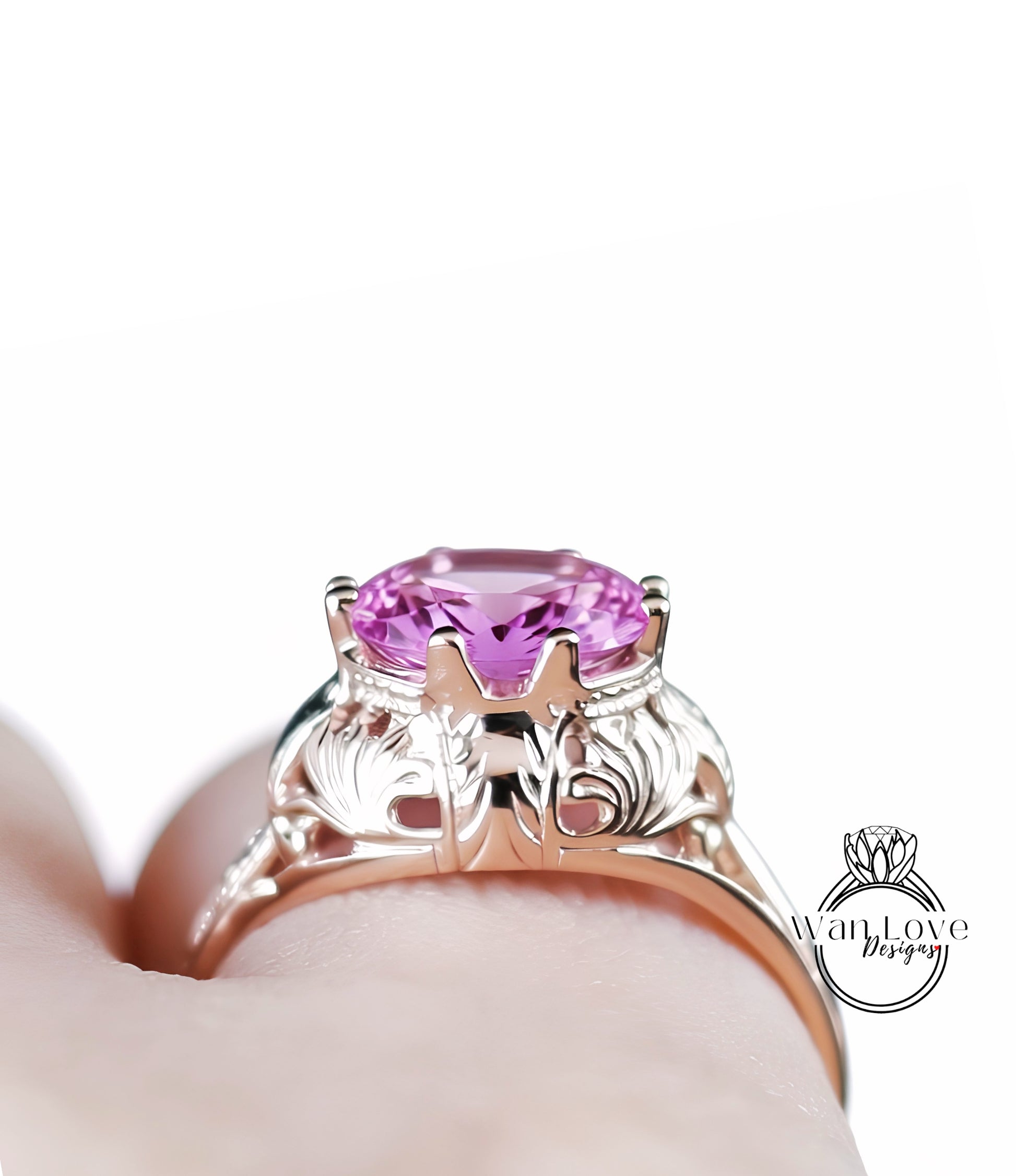 A close-up view of a person's hand wearing a gold ring with a large, round pink gemstone.