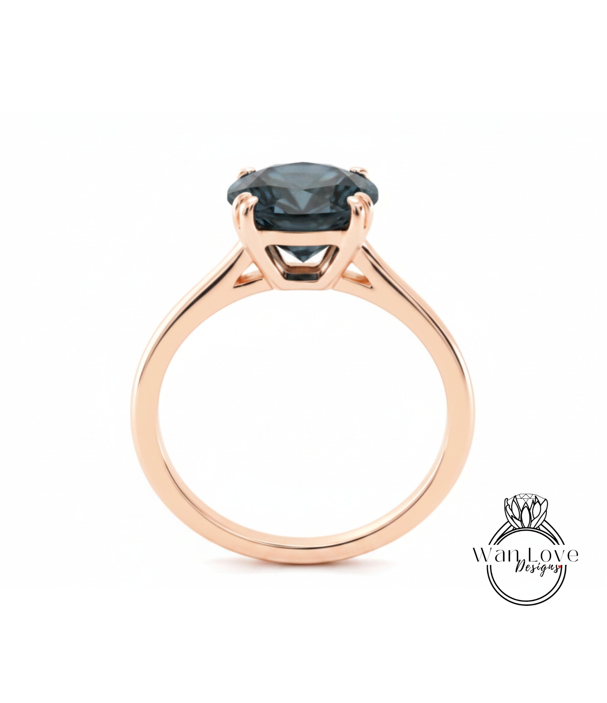 A rose gold engagement ring with a large blue gemstone set in the center.