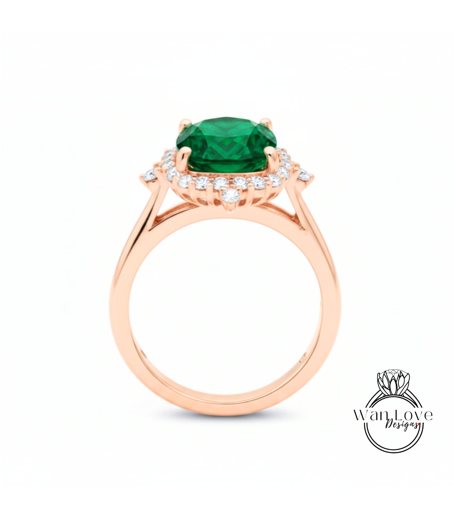 A rose gold ring with a large green gemstone set in the center, surrounded by smaller diamonds.