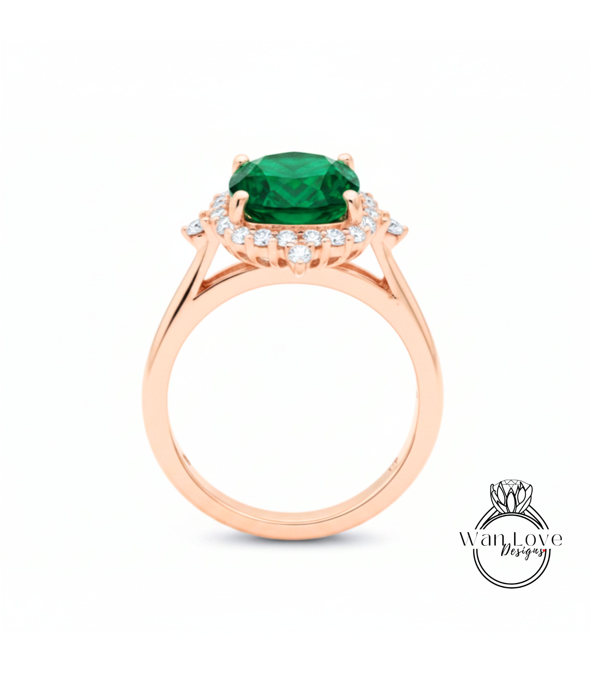 A rose gold ring with a large green gemstone set in the center, surrounded by smaller diamonds.