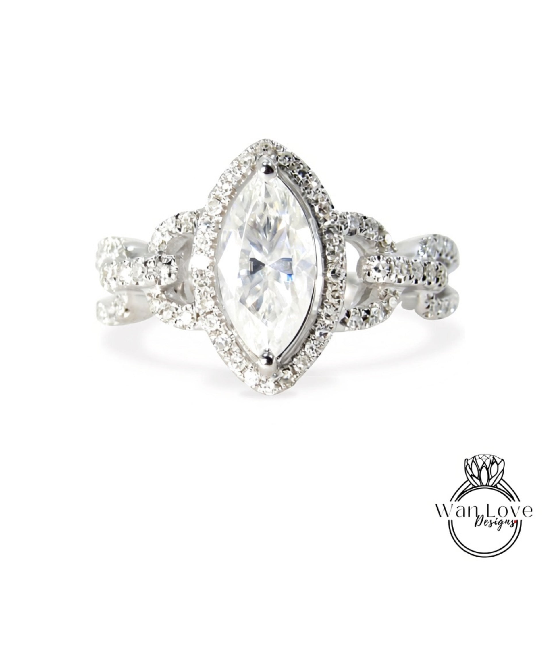 A diamond engagement ring with a large central diamond surrounded by smaller diamonds and a halo of smaller diamonds around the center stone.