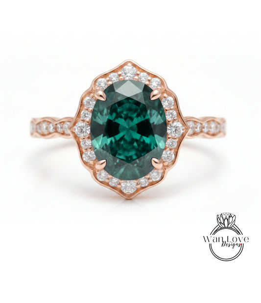 a beautiful engagement ring with a large oval-shaped gemstone set in a halo of smaller diamonds.