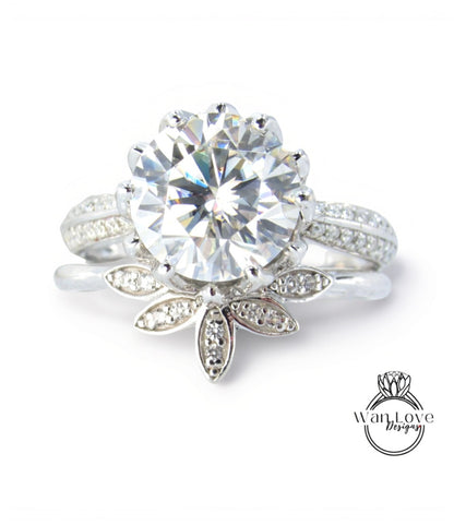A stunning diamond engagement ring with a large central diamond surrounded by smaller diamonds set in a floral-inspired design.