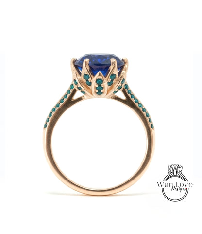 A gold ring with a large blue gemstone at the center, surrounded by small green stones.