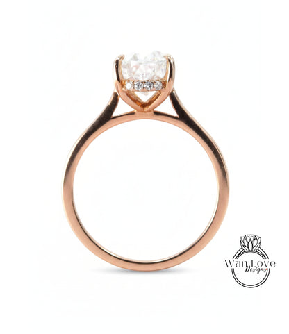 A gold ring with a large diamond set in the center, showcasing the intricate design and craftsmanship of the piece.