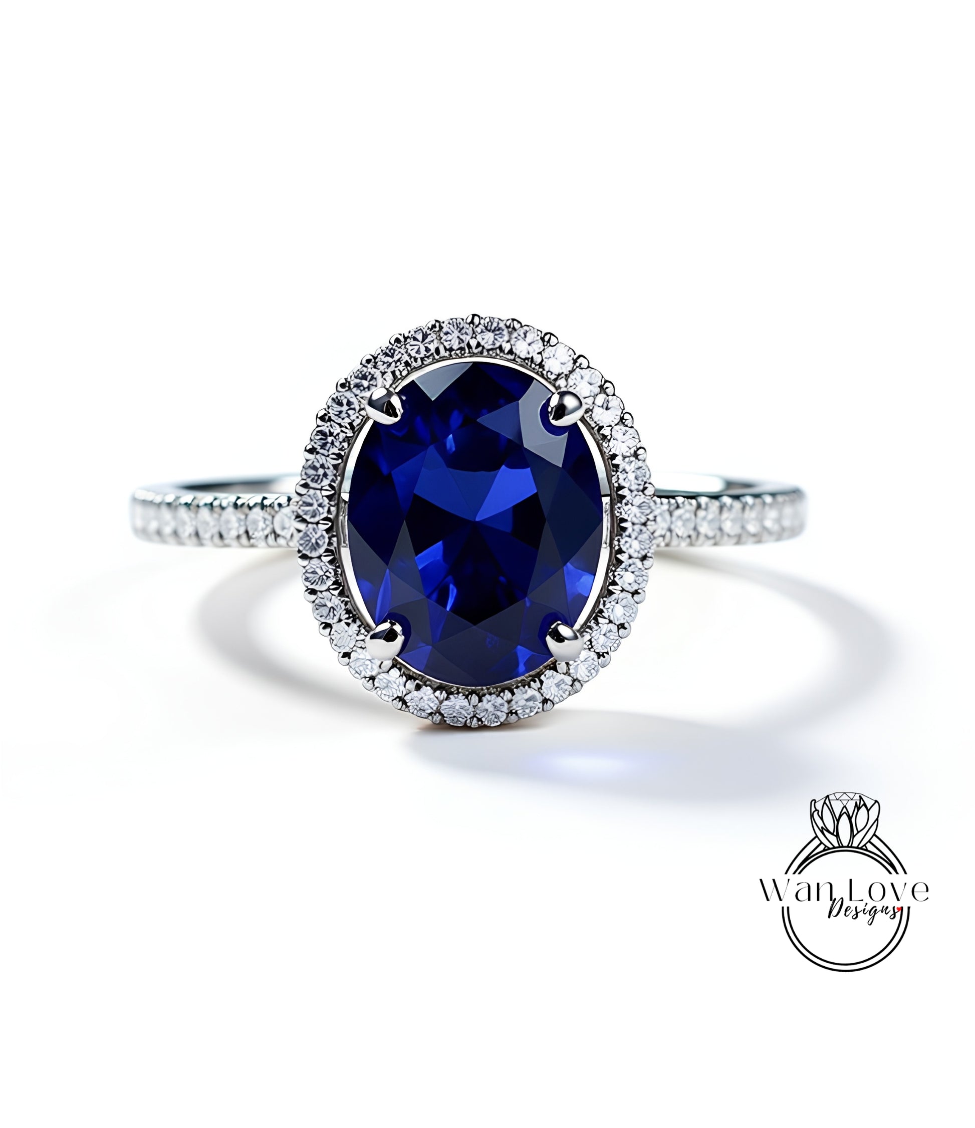 A stunning blue sapphire engagement ring with a halo of sparkling diamonds set in a silver band.