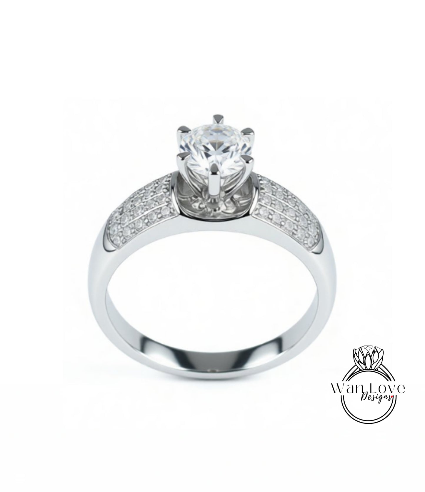 A silver engagement ring with a large central diamond surrounded by smaller diamonds on either side.