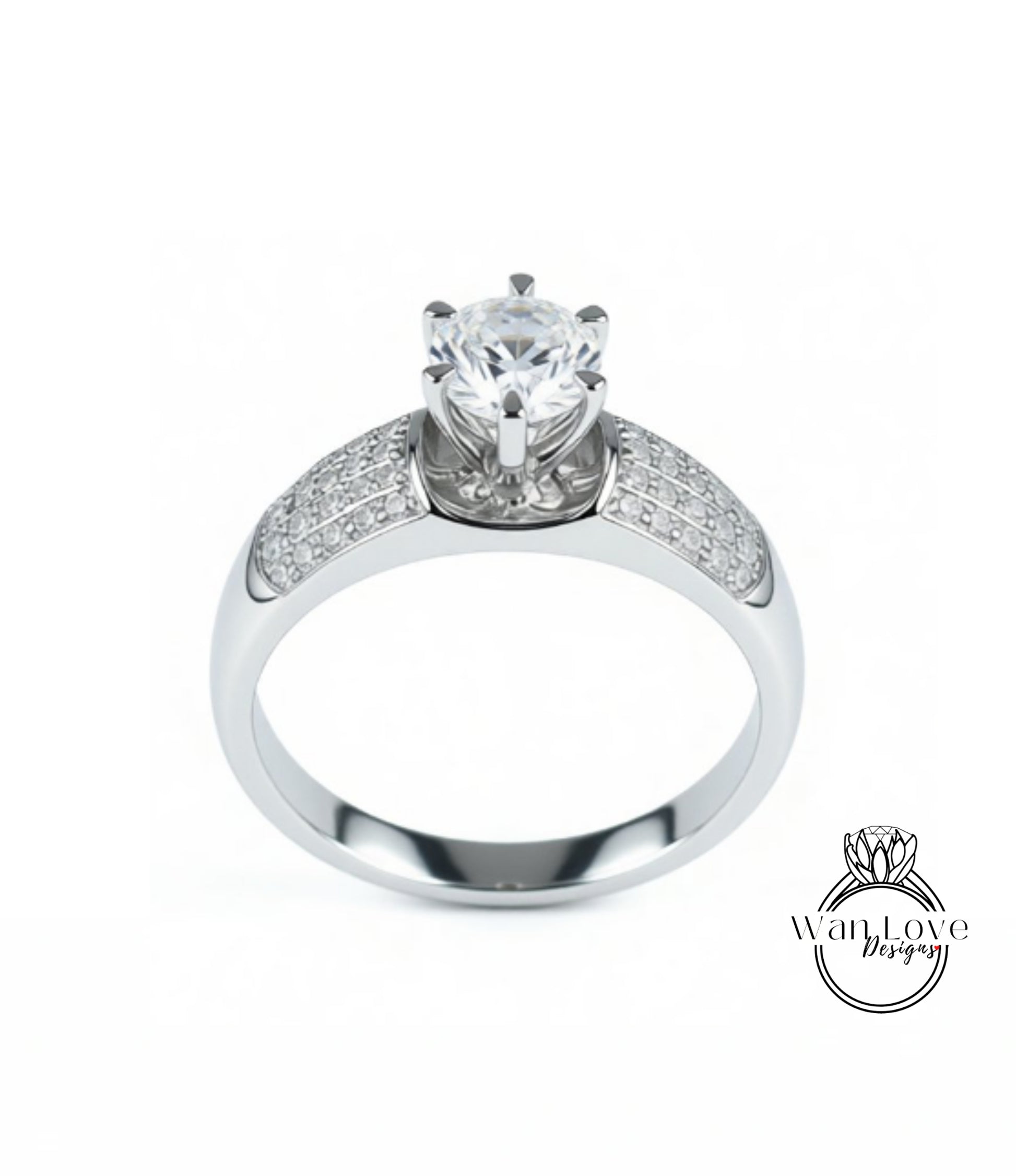 A silver engagement ring with a large central diamond surrounded by smaller diamonds on either side.
