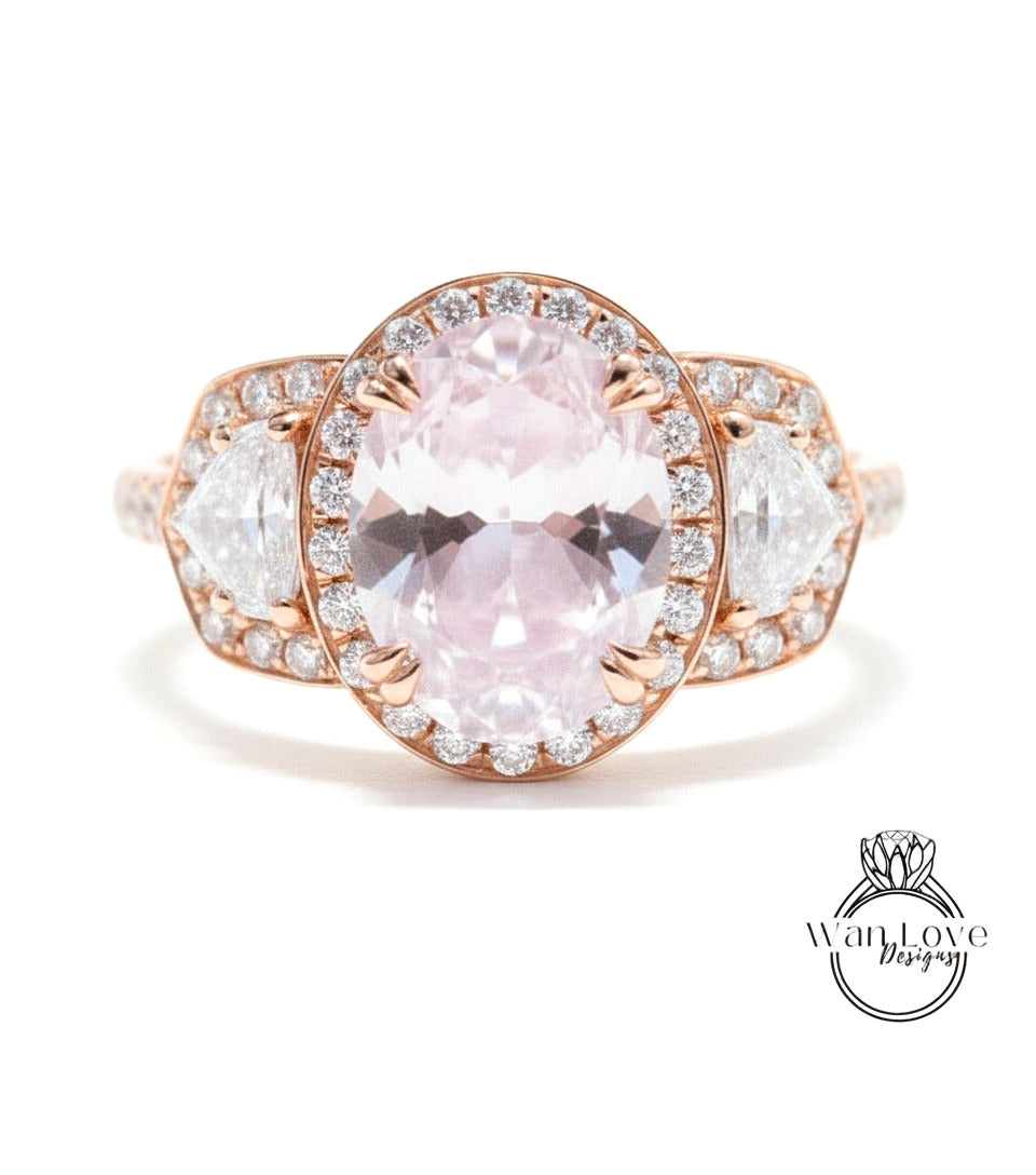 A close-up of a beautiful pink gemstone ring with a large oval-shaped gemstone surrounded by smaller diamonds.
