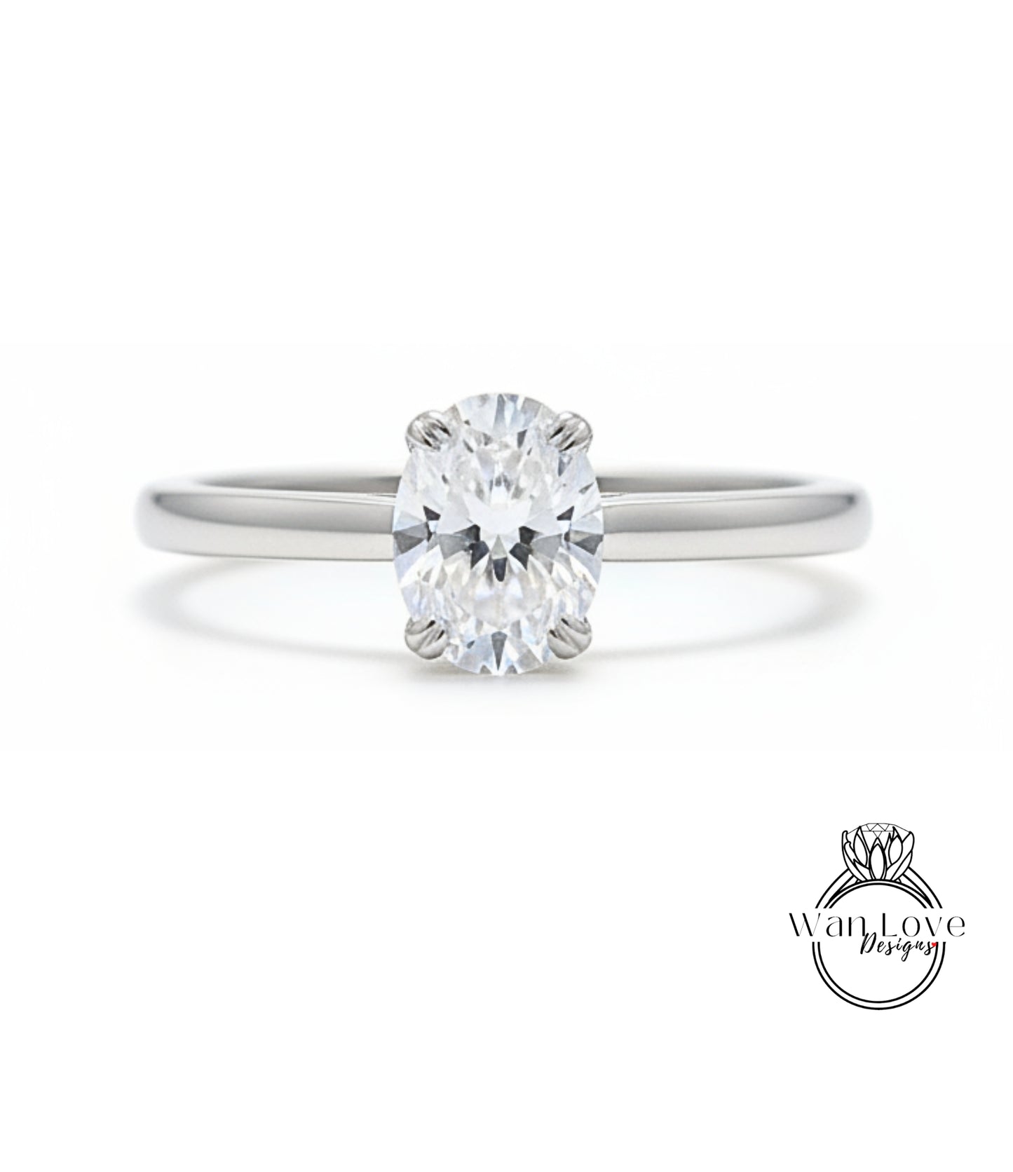 A close-up view of a diamond engagement ring with a large oval-shaped diamond set in a silver band.