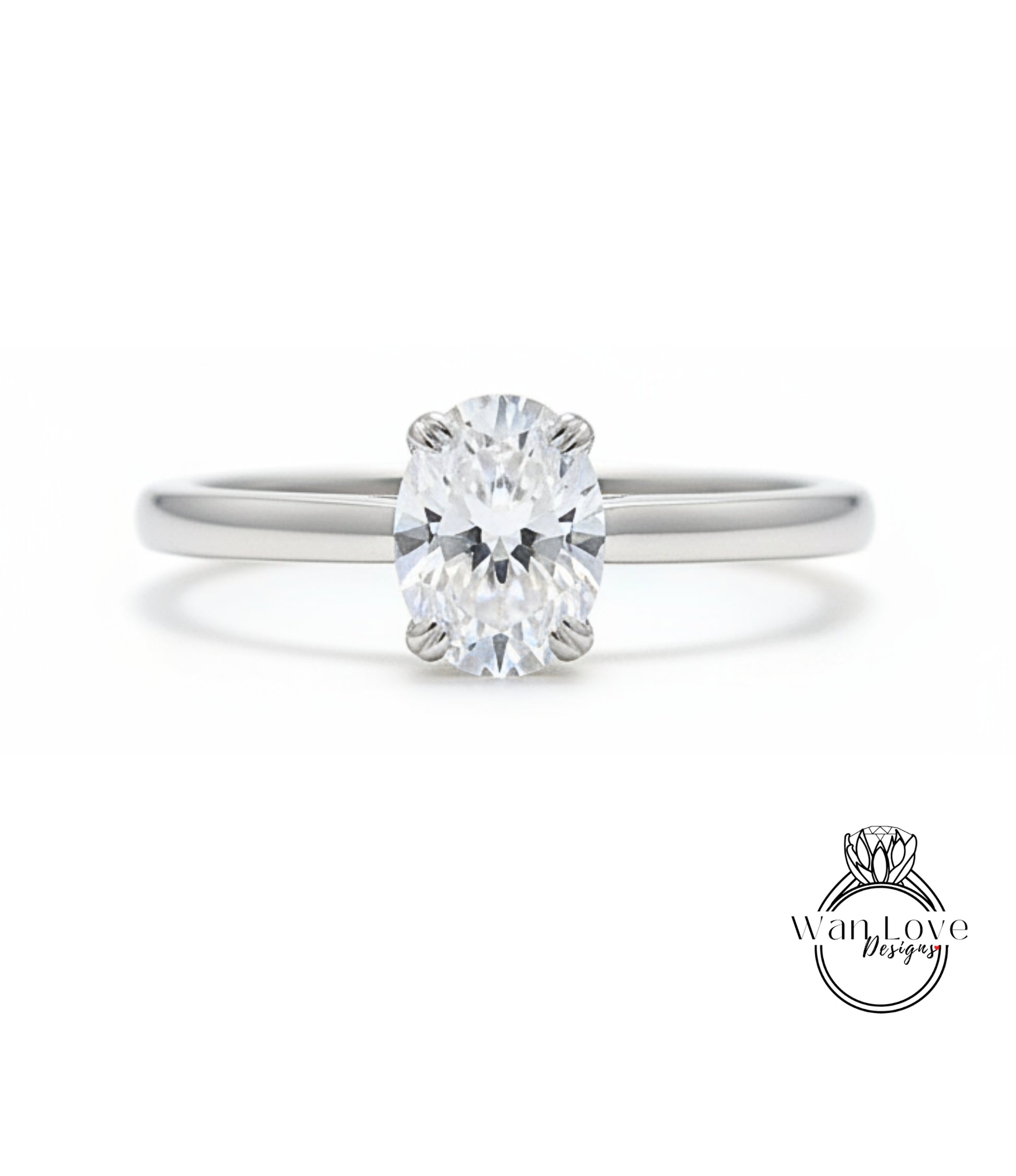 A close-up view of a diamond engagement ring with a large oval-shaped diamond set in a silver band.