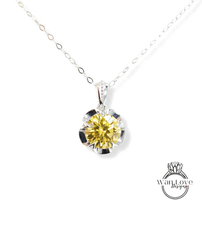 A necklace with a large yellow diamond pendant.