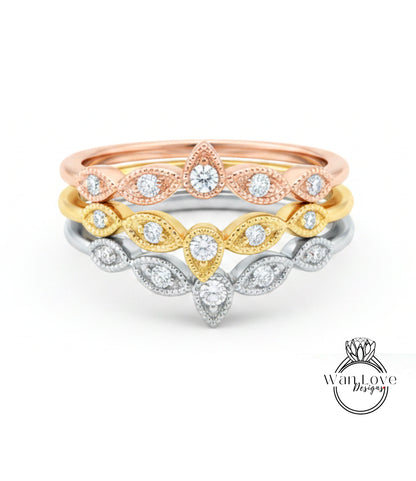 A ring with multiple tiers of diamond-encrusted designs, including a large central diamond surrounded by smaller diamonds.