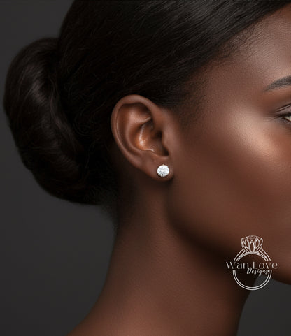 A close-up of a woman's face, focusing on her ear with a diamond earring.