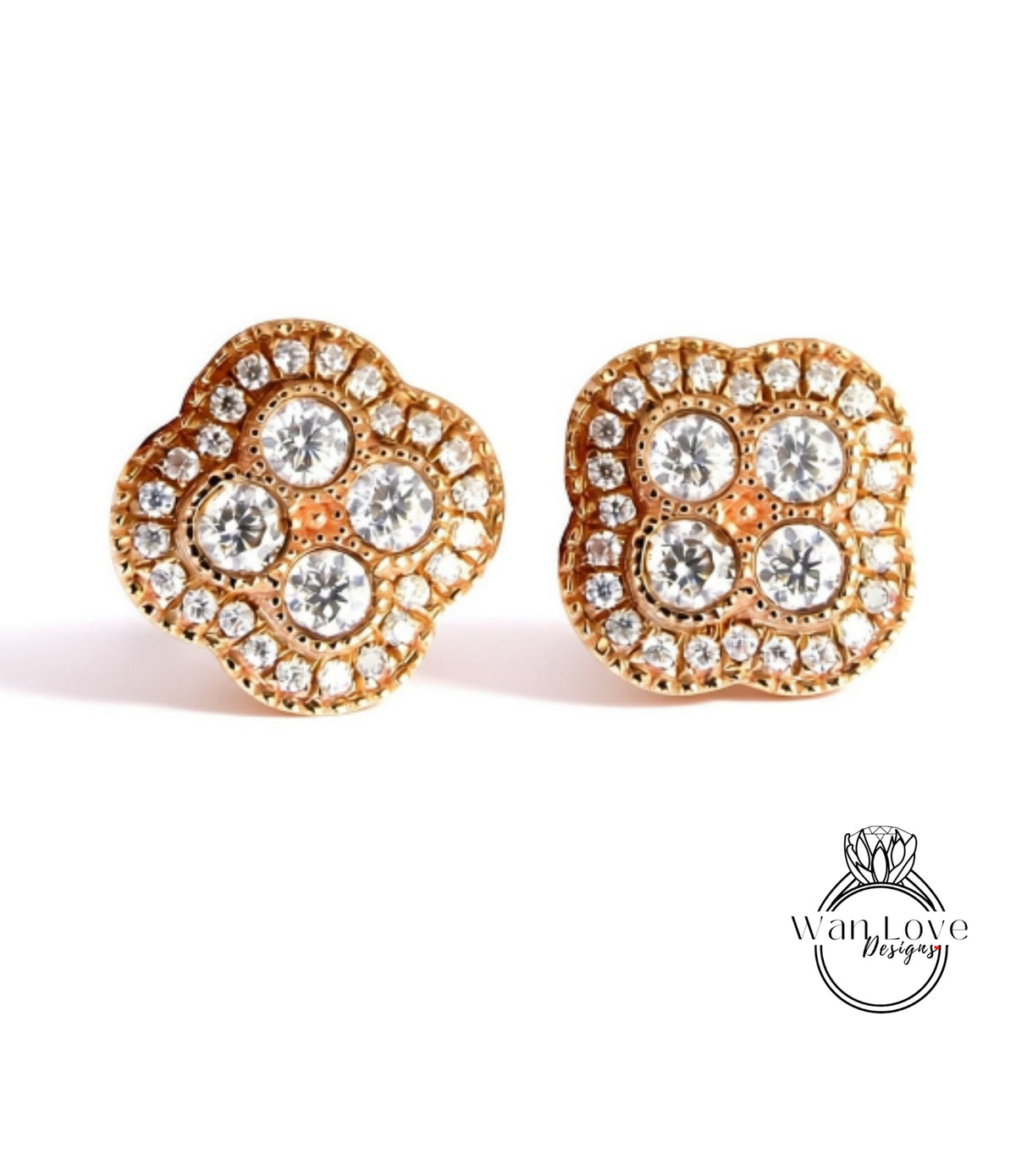 A pair of gold earrings with a large, intricate design of small diamonds set in the center.