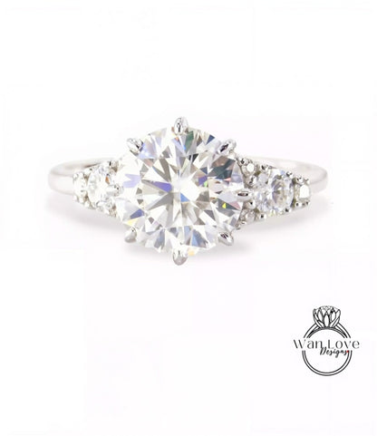 A close-up view of a diamond engagement ring with a large, brilliant-cut diamond set in a silver band.