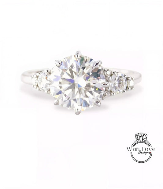 A close-up view of a diamond engagement ring with a large, brilliant-cut diamond set in a silver band.