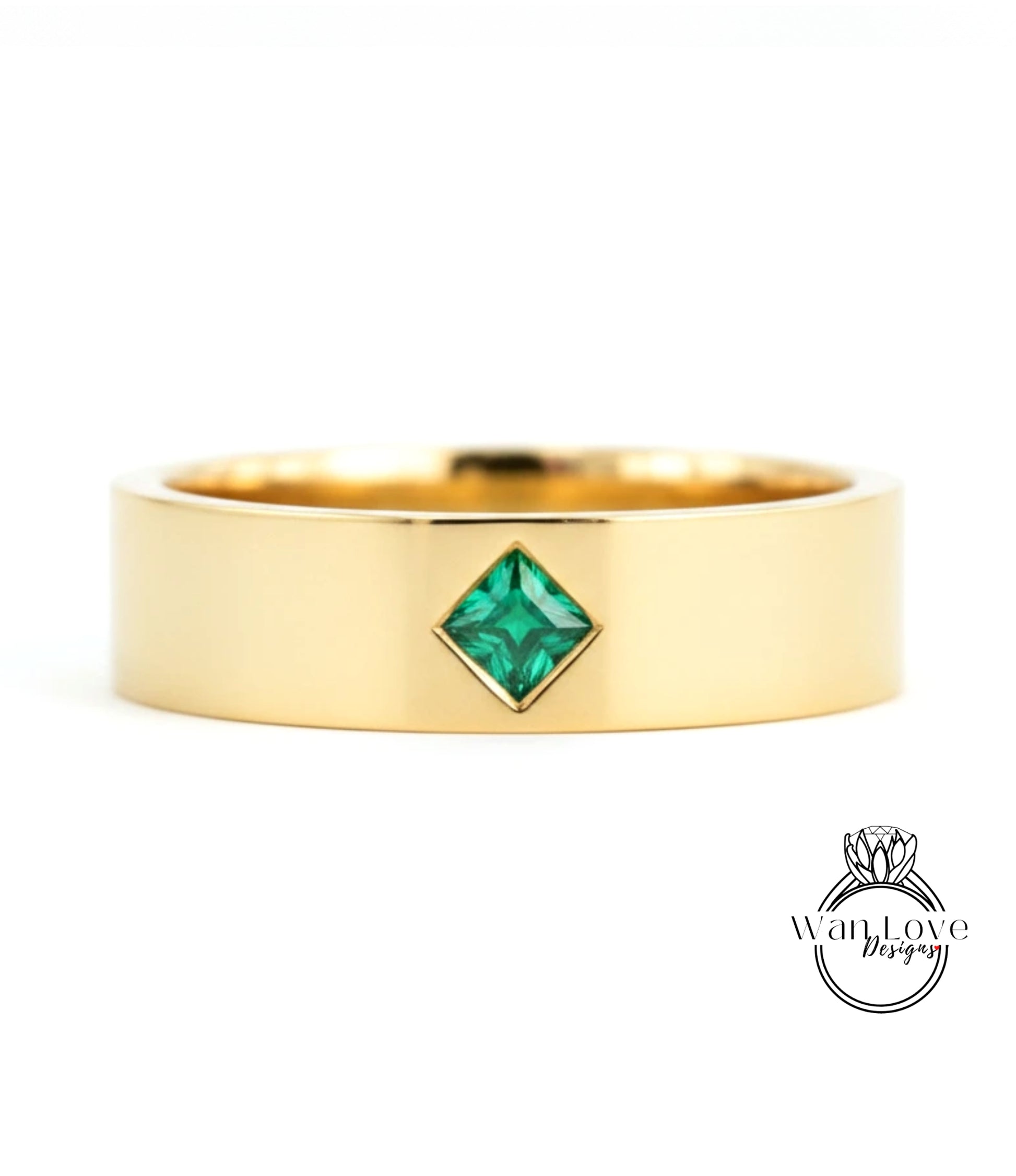 A gold ring with a diamond-shaped gemstone set in the center.