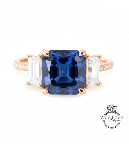 A close-up of a gold ring with a large blue gemstone in the center, surrounded by smaller white gemstones.