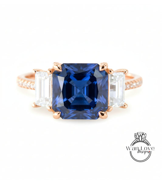 A close-up of a gold ring with a large blue gemstone in the center, surrounded by smaller white gemstones.