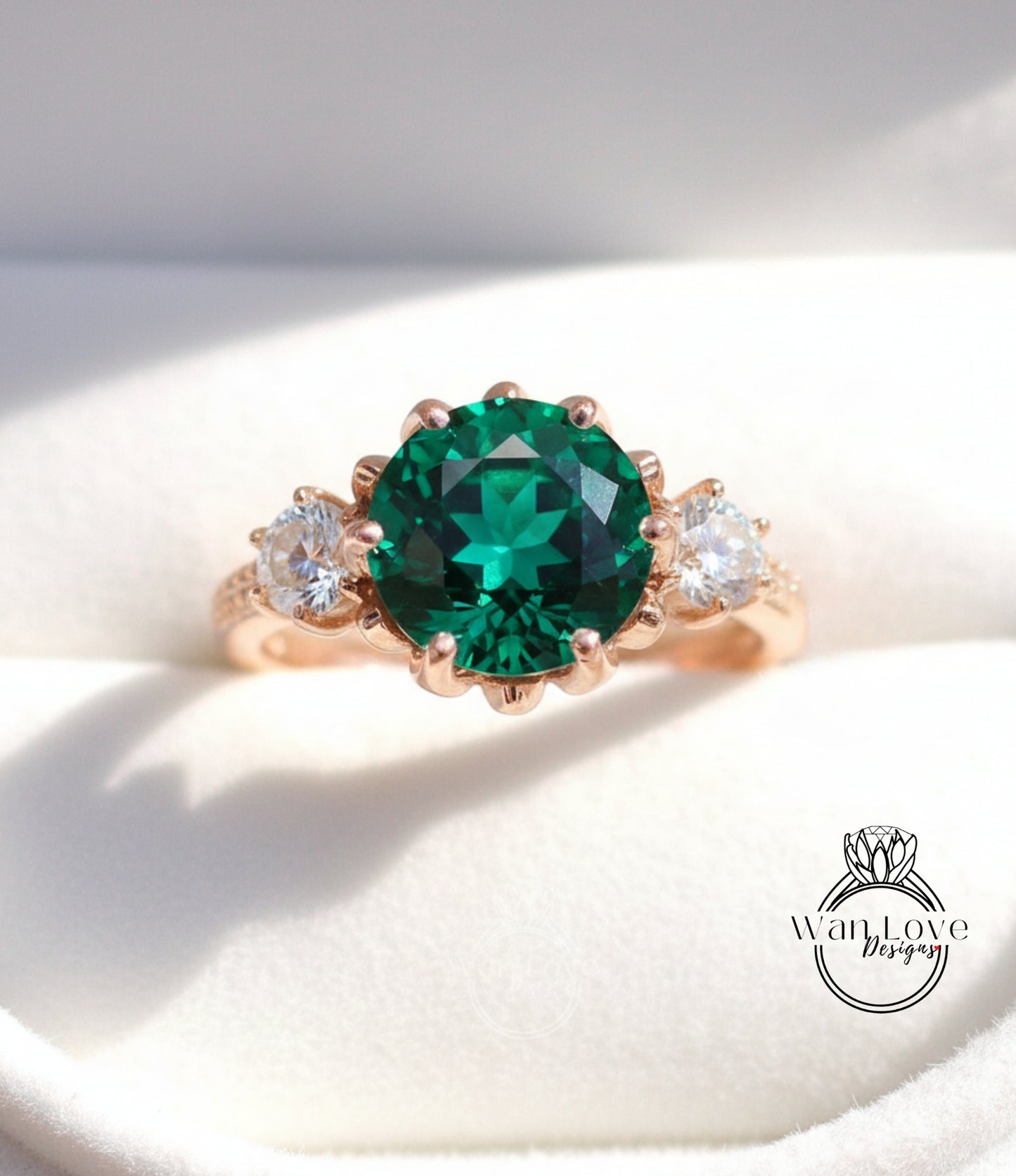 A close-up image of a gold ring with a large, green gemstone in the center, surrounded by smaller diamonds.