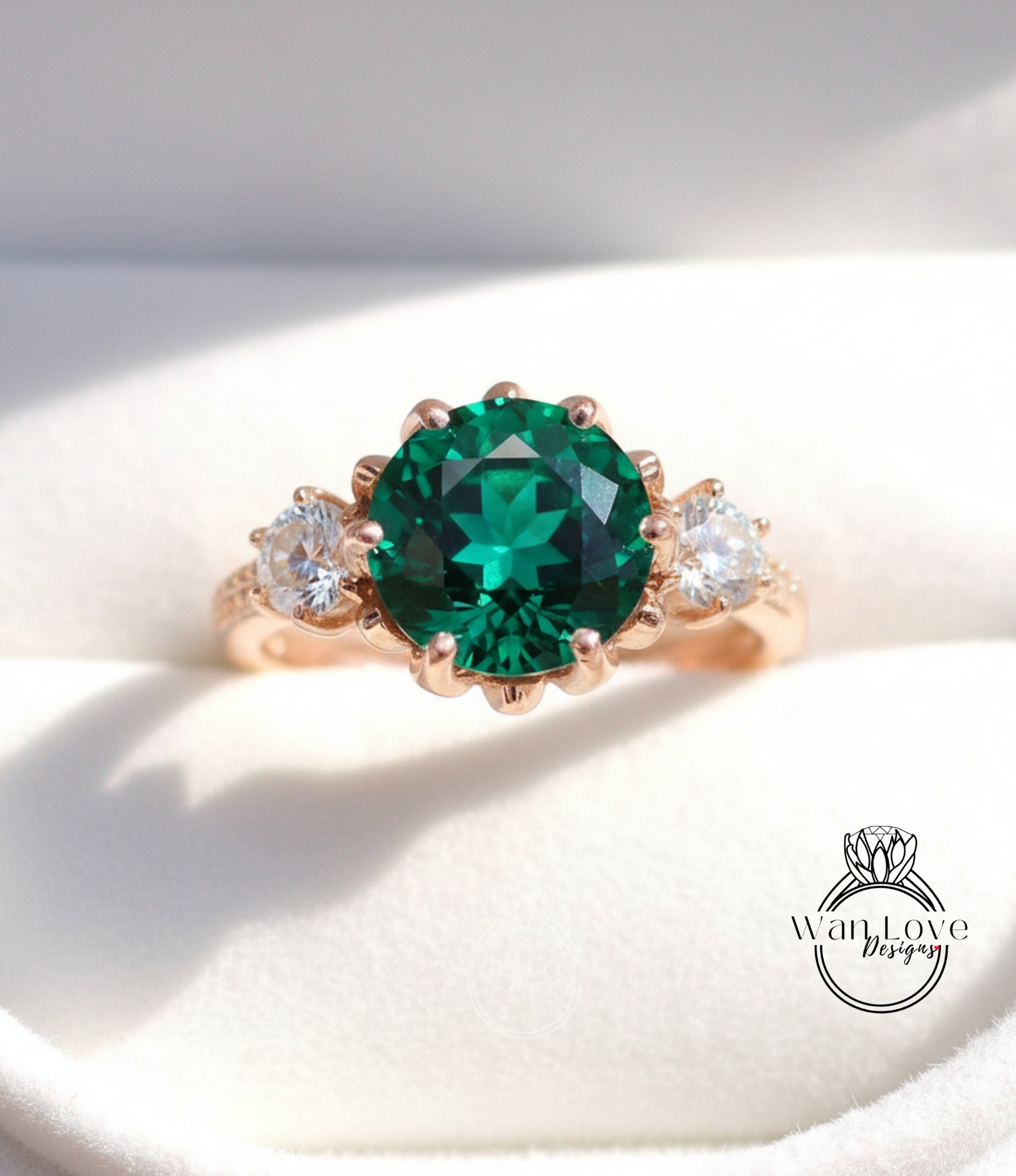 A close-up image of a gold ring with a large, green gemstone in the center, surrounded by smaller diamonds.