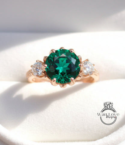 A close-up image of a gold ring with a large, green gemstone in the center, surrounded by smaller diamonds.