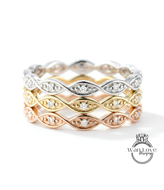 A ring with multiple layers of rings, each with a diamond set in the center. The rings are arranged in a circular pattern, creating a layered design.