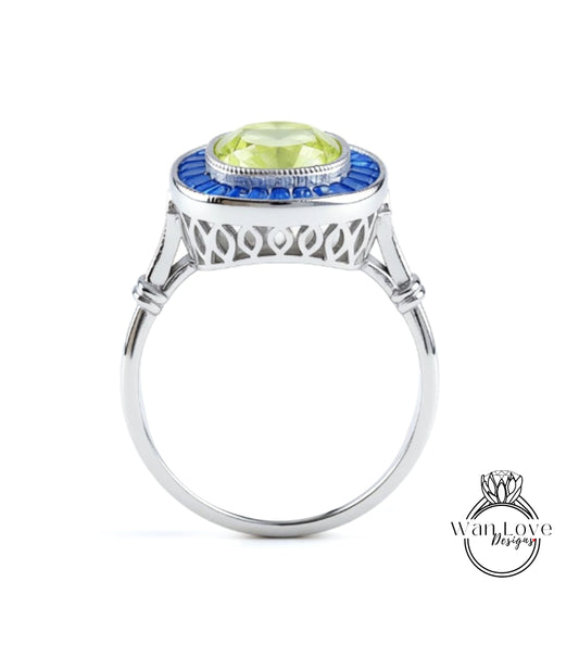 A silver ring with a blue and green gemstone set in the center.