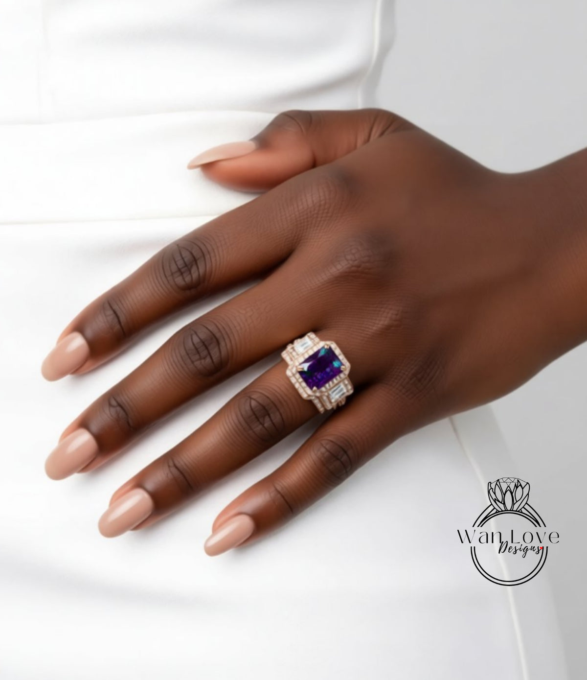 A close-up of a hand wearing a ring with a large purple gemstone.