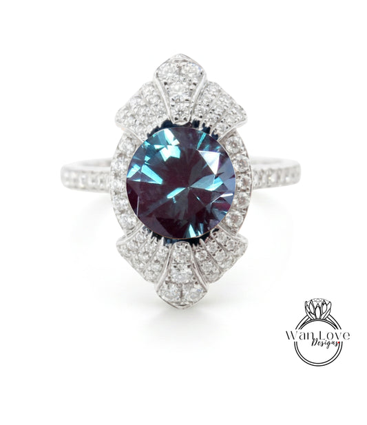 A stunning diamond ring with a large blue gemstone set in a silver band, surrounded by smaller diamonds.