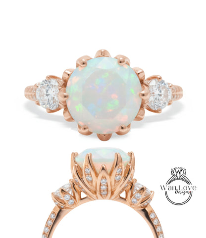 a beautiful engagement ring with a large opal gemstone set in a rose gold band. The ring is adorned with smaller diamonds and has a delicate floral design.