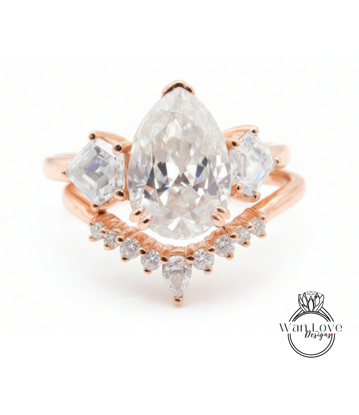a beautiful engagement ring with a large pear-shaped diamond set in a rose gold band, surrounded by smaller diamonds.