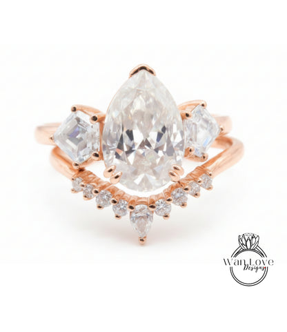 a beautiful engagement ring with a large pear-shaped diamond set in a rose gold band, surrounded by smaller diamonds.