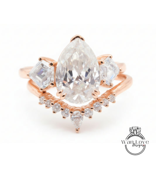 a beautiful engagement ring with a large pear-shaped diamond set in a rose gold band, surrounded by smaller diamonds.